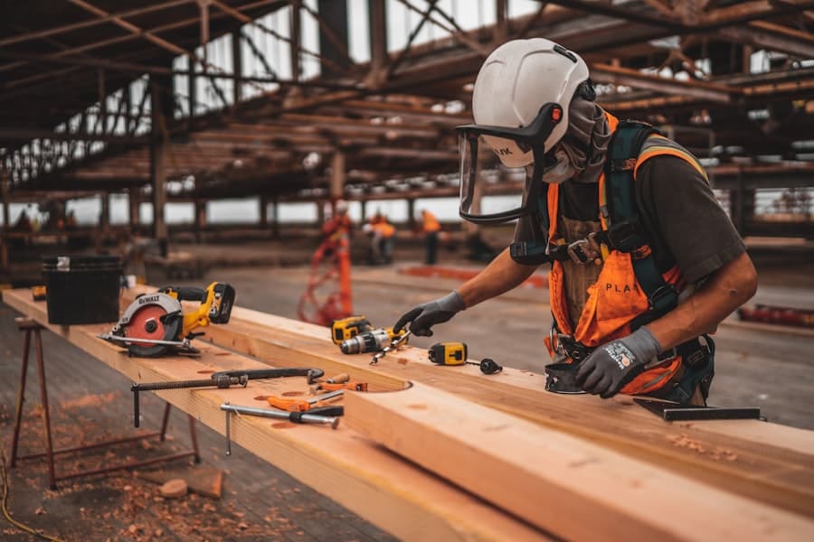 Industrial technician working with a power tool on a job site